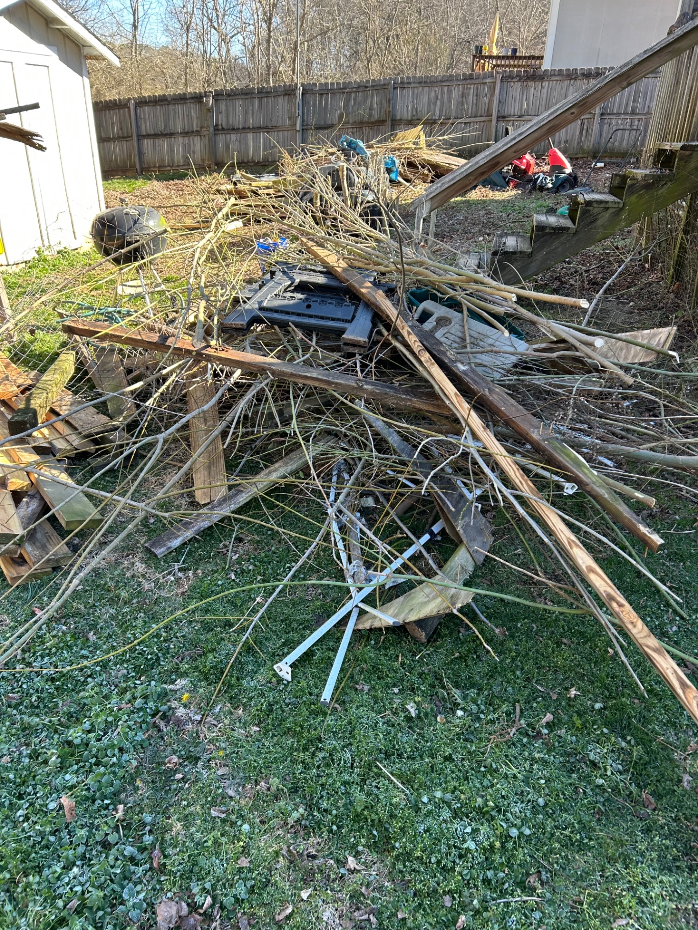 Before: debris pile awaiting full removal
